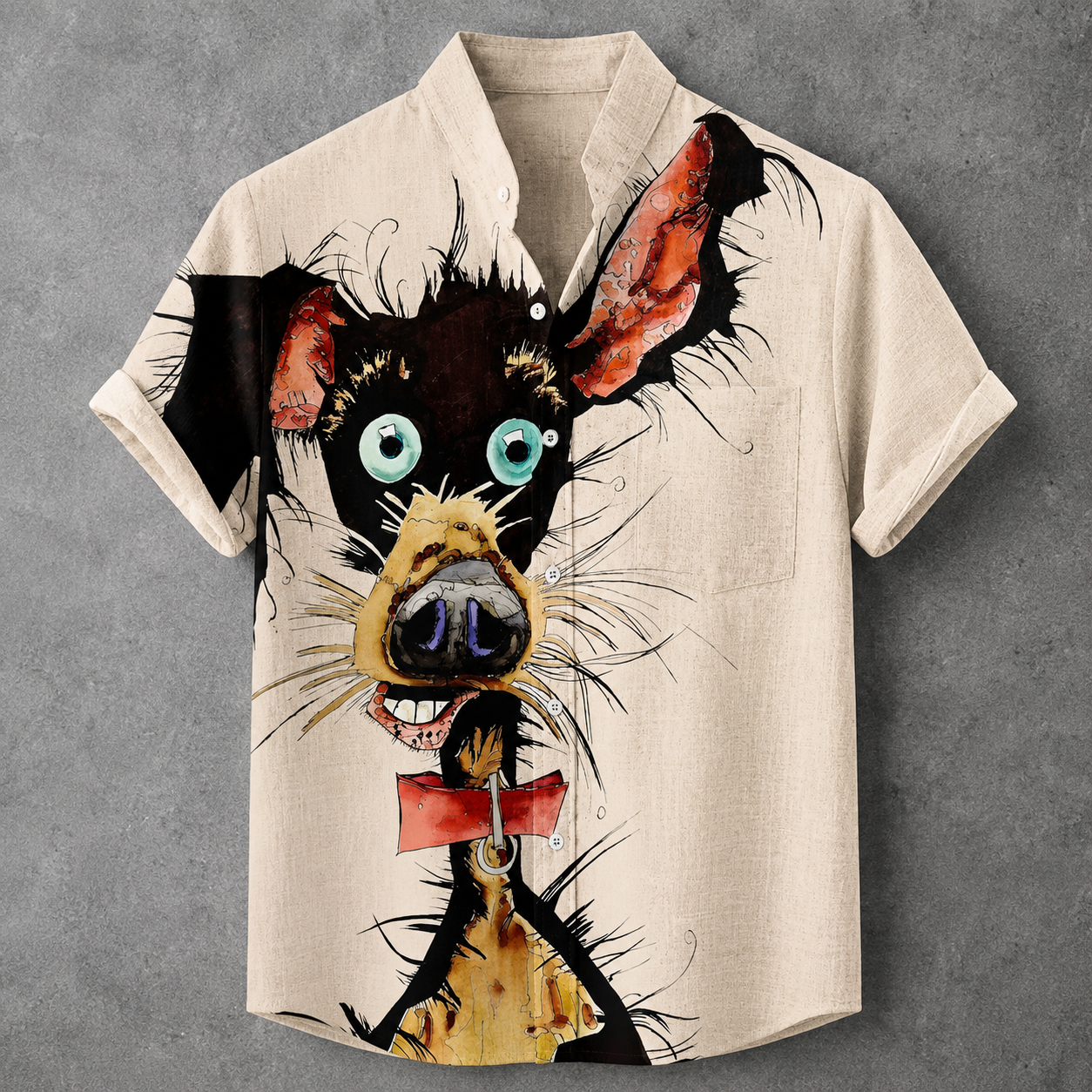 A short-sleeve button-up shirt in a light beige linen-like fabric, featuring a large, stylized cartoon dog face graphic printed on the front. The dog has black fur, bright blue-green eyes, a yellow snout, and a red collar.