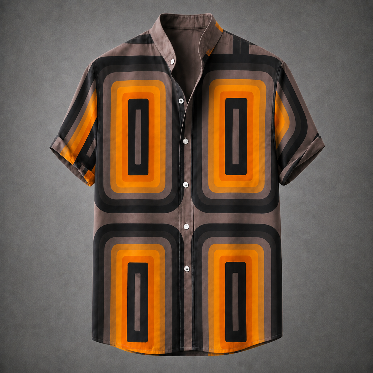 A short-sleeve button-up shirt with a retro 1970s geometric pattern featuring orange, black, and brown concentric rectangles, displayed on a gray background.