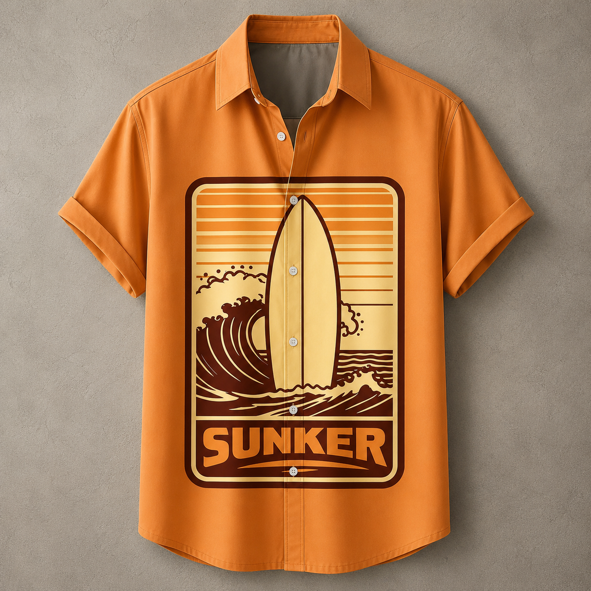 An orange short-sleeve button-up shirt with a vintage-style surf graphic on the front. The graphic features a wooden surfboard, ocean waves, and the word 'SUNKER' in bold letters.