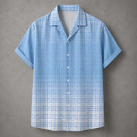 A light blue and white plaid short-sleeve button-up shirt with a camp collar, displayed flat against a textured gray background.
