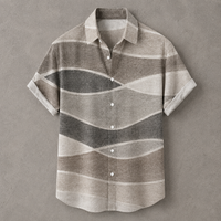 A short-sleeve button-up shirt with a wavy horizontal stripe pattern in shades of taupe, gray, and cream, displayed flat against a textured gray background.