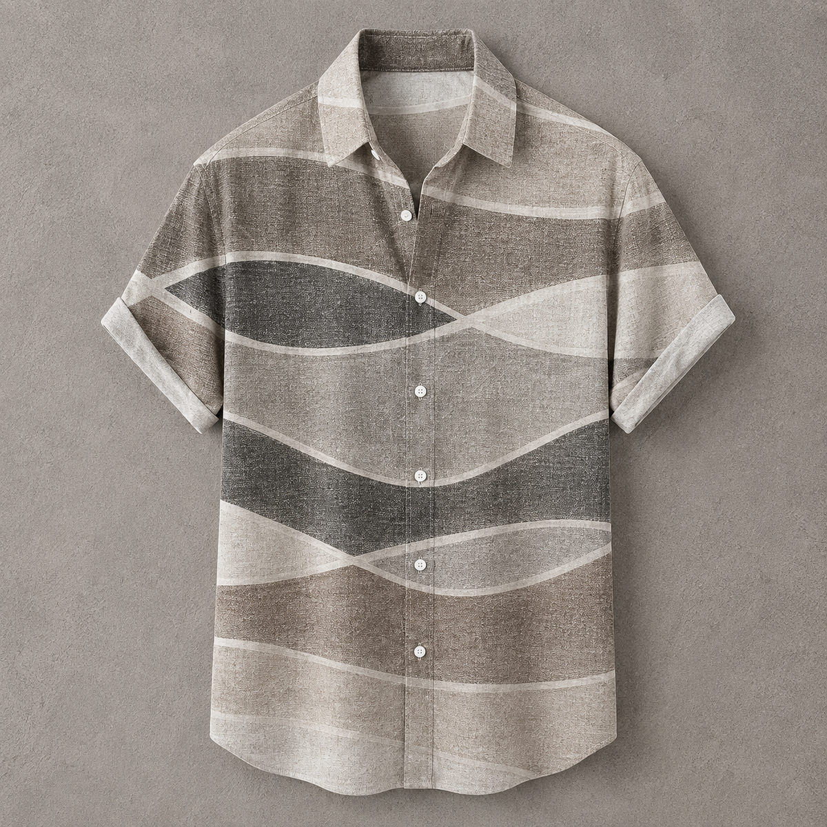 A short-sleeve button-up shirt with a wavy horizontal stripe pattern in shades of taupe, gray, and cream, displayed flat against a textured gray background.