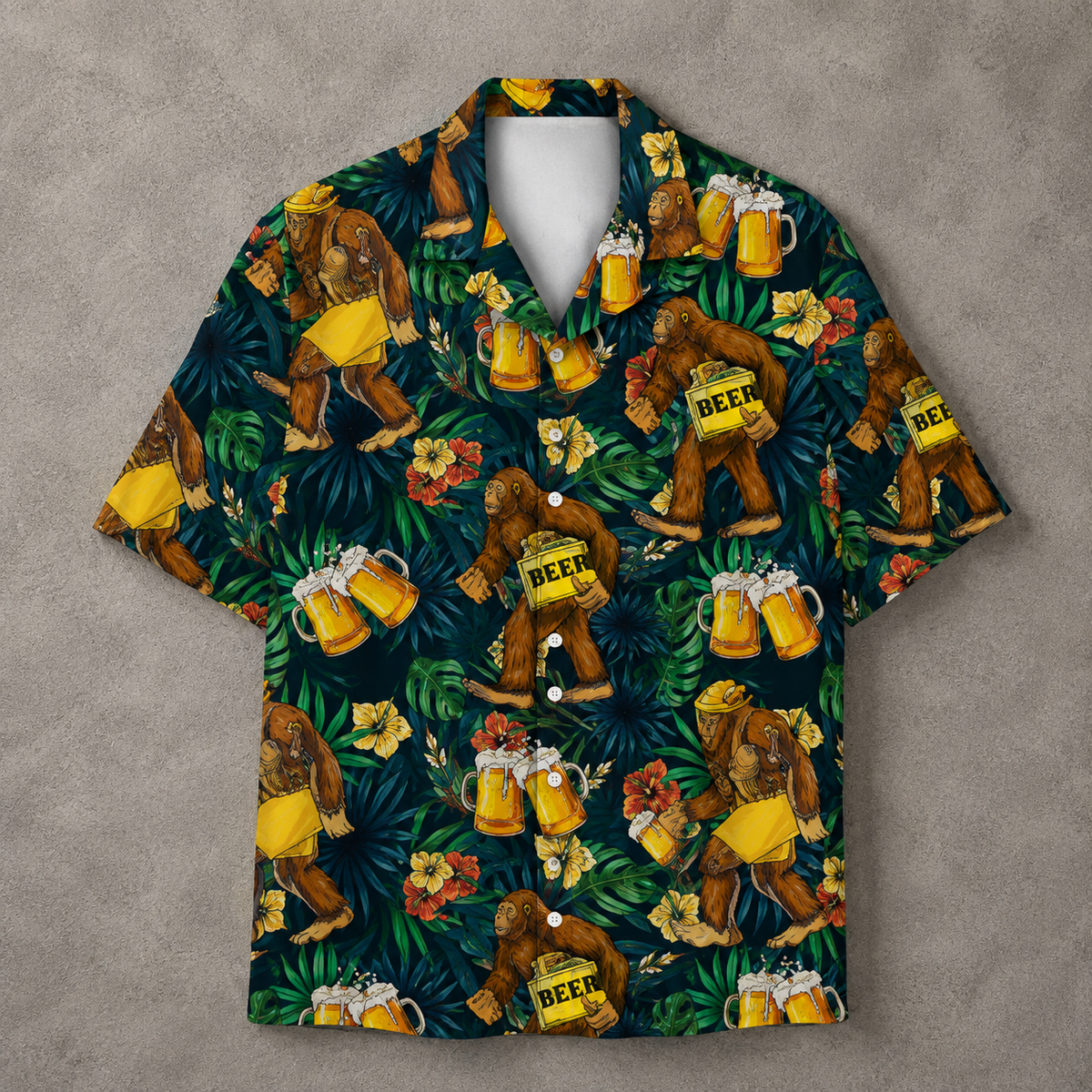 A short-sleeve button-up camp shirt with a dark tropical print featuring Bigfoot figures, beer mugs, and flowers. The shirt is displayed flat on a textured gray background.