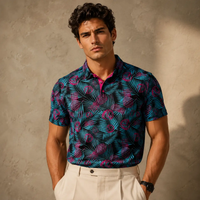 Man wearing a patterned shirt against a neutral background
