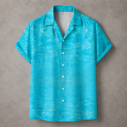A short-sleeve button-up camp shirt in bright turquoise blue with a light yellow water ripple pattern, displayed flat against a textured gray background.